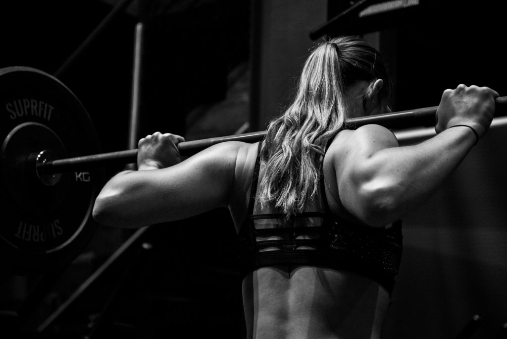 Squatting with barbell
